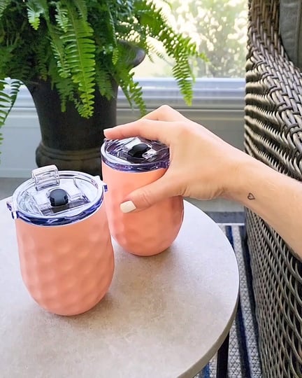 ugc content creator grabbing insulated portable wine glass